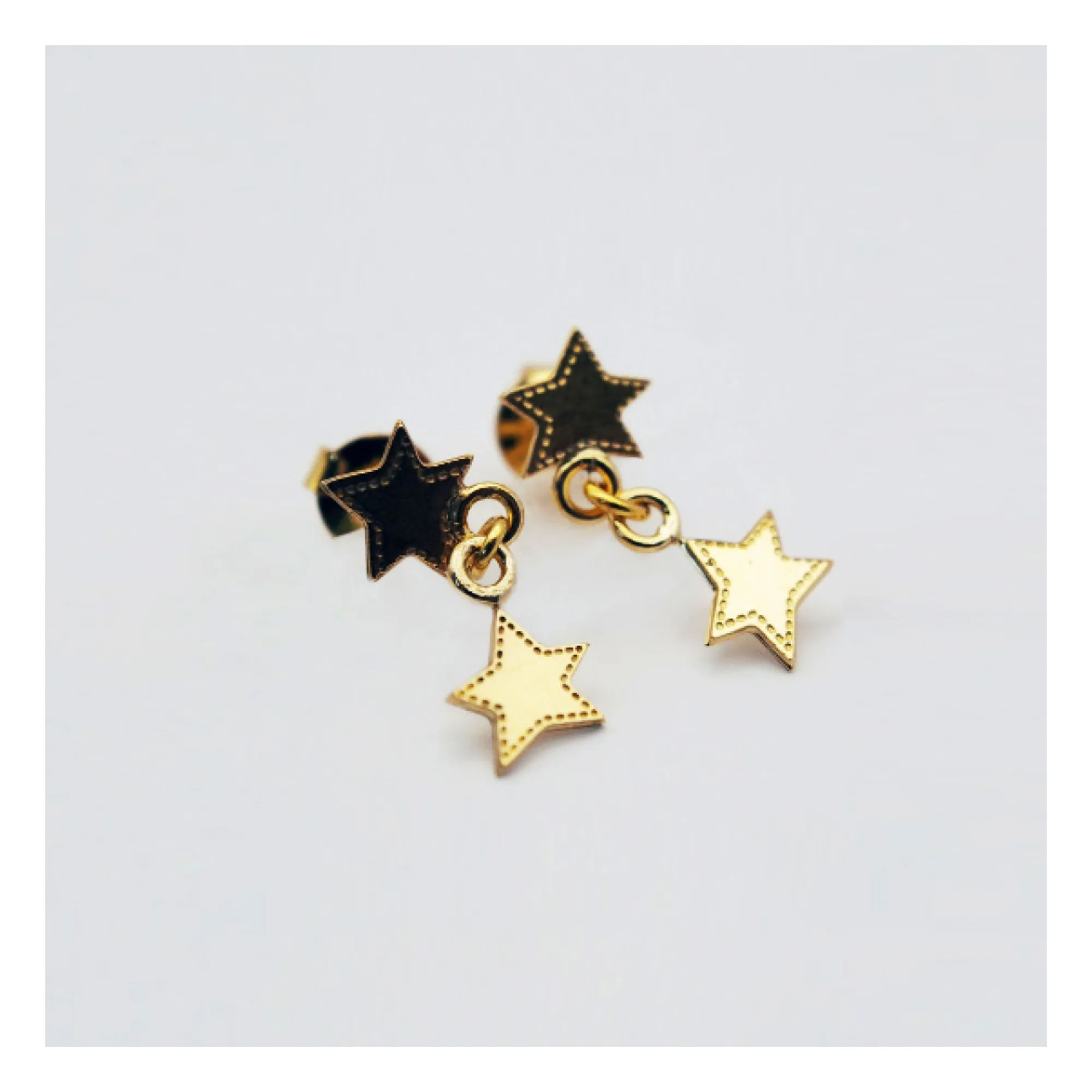 Adorabili Pendientes Estrella Doble | Dorado